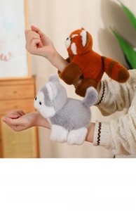 Detail of plush animal slap bracelets showing soft red panda and husky texture on wrist