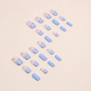 Light blue and pink gradient square fake nails with dark blue butterflies and glitter