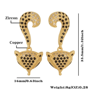 Detail view of copper leopard earrings with zircons and size markings 33.5mm by 16mm
