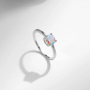 Elegant S925 sterling silver ring with iridescent round cubic zirconia on white background