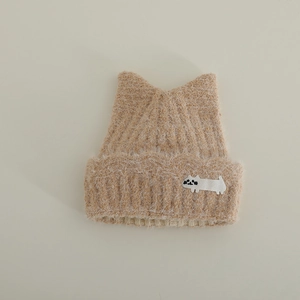 Close-up of khaki plush knit hat with cat ear design and cute white cat embroidery