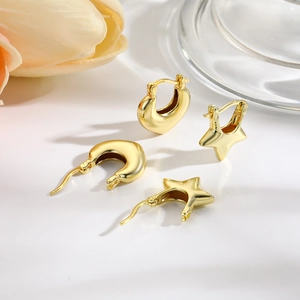 Chic hollow star and curved golden hoop earrings set with a polished finish for women