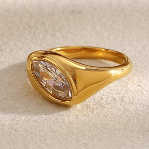 Retro 18K gold plated stainless steel ring with marquise cut crystal on beige felt