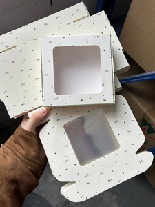 Flat lay and assembled view of white gift box with window and star patterns
