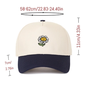 Front view of color-block baseball cap with daisy embroidery and size measurements