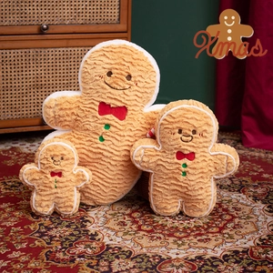Plush gingerbread man pillows in three sizes featuring soft texture and festive embroidery
