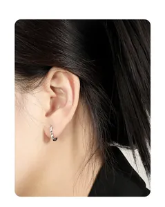 Close-up of S925 sterling silver U-shaped hoop earring with unique textured punk design