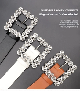 Detail of square alloy buckles encrusted with rhinestones on black, white, and brown belts