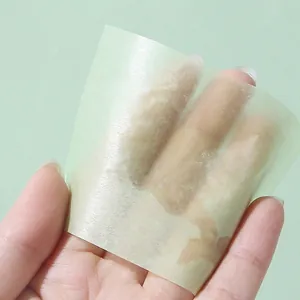 Face oil absorbing sheets for skin control showing the translucent paper texture effect