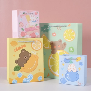 Creative fruit themed paper gift bags with handles in peach lemon and berry designs