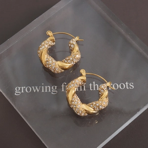 U-shaped gold plated titanium steel hoop earrings with twisted design and pavé zircon stones