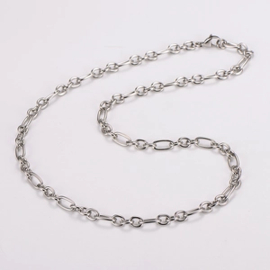 Detailed view of silver stainless steel oval link chain with secure lobster clasp