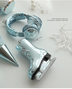Detail of light blue Christmas ornaments with silver glitter in various shapes and textures