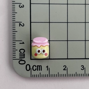 Miniature resin jar accessory with cute cartoon eyes and pink lid for DIY jewelry