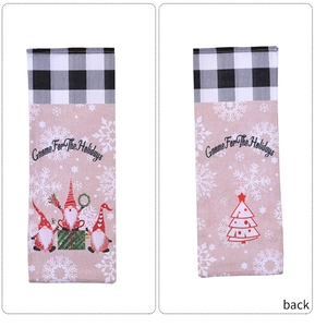 Detail view of gnome Christmas wine bottle bag with buffalo plaid trim and holiday graphics