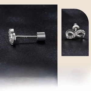 Macro detail of S925 hallmark on infinity stud earrings with sparkling diamonds