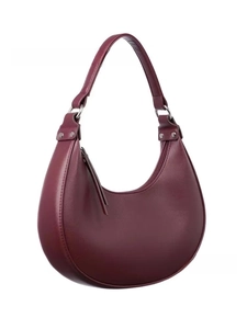 Detail of burgundy leather half-moon bag featuring silver hardware and a smooth zipper top