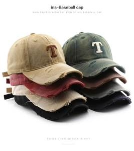 Detail view of washed vintage baseball caps in multiple colors with distressed brim effects