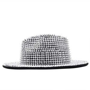 Punk style black felt fedora hat decorated with silver metal rivets on white background