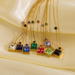Detail of colorful square crystal pendants on gold plated stainless steel necklaces