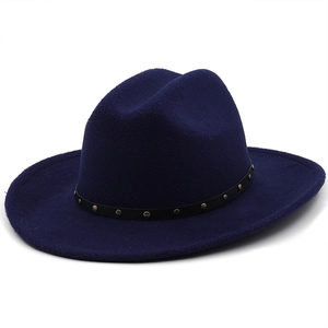 Detail of dark blue felt cowboy hat with black belt band and metallic rivet accents