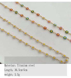 Macro detail of colorful beaded daisy necklaces in titanium steel on white surface