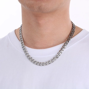 Male model wearing chunky silver Figaro chain necklace in stainless steel with square clasp