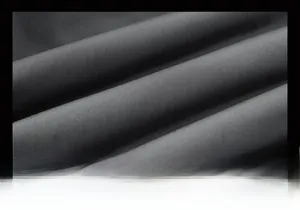 Detail shot of warm black thick winter fabric with soft twill texture for men jackets