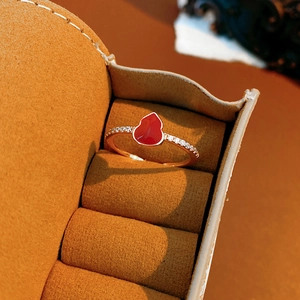 Macro shot of an 18k gold-plated red gourd ring with sparkling pave zircon accents