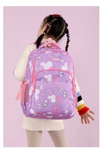 Pink school backpack featuring cute cartoon rabbit prints and breathable mesh straps