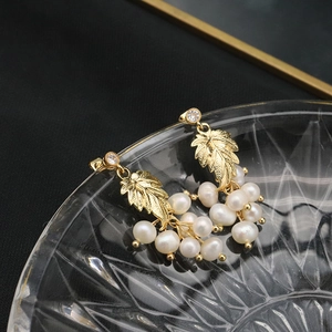 Elegant natural freshwater pearl drop earrings with 18k gold leaf accents and zircon detail