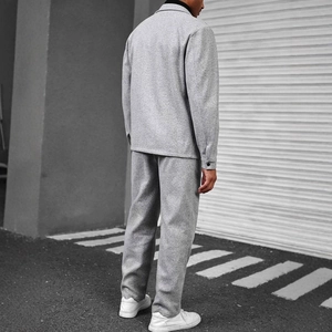 Detail view of the gray business casual suit set showing the back tailoring and fit on a model