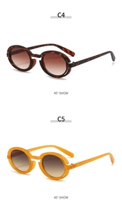Detail view of retro round punk sunglasses in dark tortoise and transparent orange