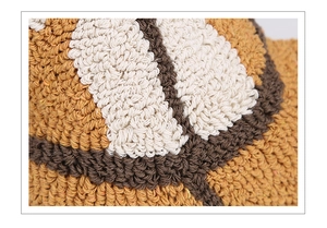 Macro shot of yellow and white tufted knit texture with detailed geometric yarn patterns