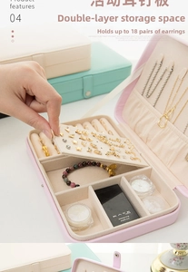 Dual-layer jewelry box interior showing 18 earring slots and necklace hooks in pink leather