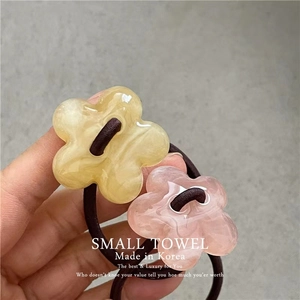 Pink and amber acrylic flower hair ties with elastic bands for ponytails in a set of two