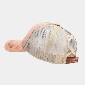 Detail of criss-cross elastic ponytail opening and breathable mesh on baseball cap