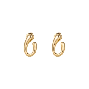 Macro shot of polished gold-plated teardrop earrings with a sleek metallic finish