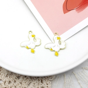 Detailed close-up of a funny duck charm with a golden edge on a decorative tray