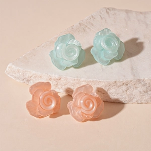 Chic resin flower stud earrings in mint green and peach pink with pearlescent finish