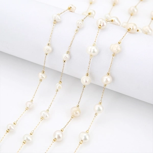 Macro detail of 18k gold-plated stainless steel chain with 5-7mm natural freshwater pearls