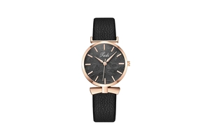 Detail of rose gold ladies watch with black leaf texture dial and leather strap