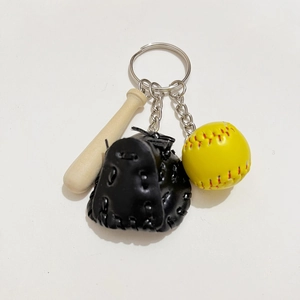 Detailed close-up of baseball keychain set with wood bat, leather glove, and rubber ball