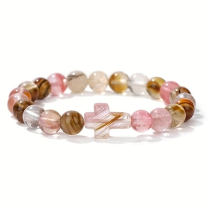 Natural stone turquoise and lava agate beaded bracelet with cross charm on white background