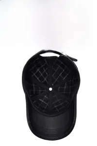 Detail of men's leather baseball cap showing quilted lining and adjustable metal buckle