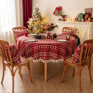 Red Christmas tablecloth and pillowcase with reindeer patterns and fringe decor