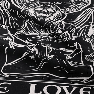Bohemian tapestry featuring a black skull with Love text print and cotton fiber texture