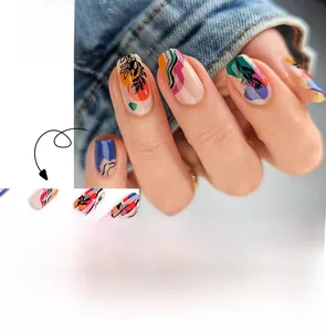 Artistic press-on nails with colorful graffiti patterns and botanical line art details