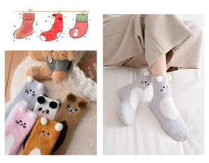 Detail of soft coral fleece socks with cute cartoon animal designs for winter