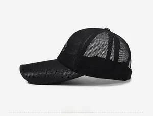 Close-up of black breathable mesh baseball cap with side sports logo and mountain icon